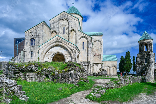 Medieval Bagrati Cathedral with a green domed roof and bell tower on Ukimerioni Hill above the city of Kutaisi, Imereti region, Georgia
