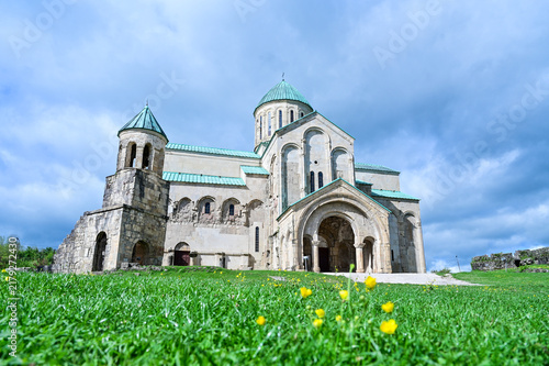 Medieval Bagrati Cathedral with a green domed roof and bell tower on Ukimerioni Hill above the city of Kutaisi, Imereti region, Georgia