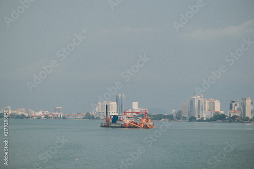 Foto Sand Dredging Ship Parked Near Shore of Penang Island, Malaysia.