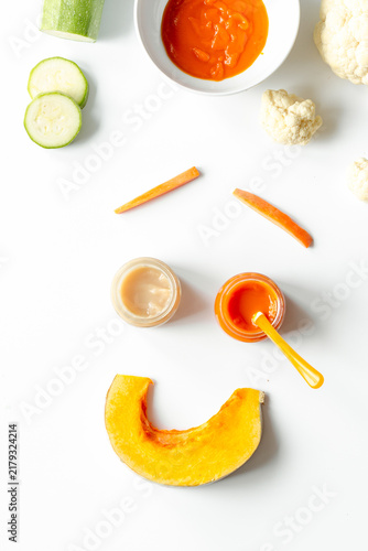 cooking vegetable puree for baby on white background top view