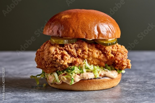 Crispy fried chicken sandwich with pickles and shredded lettuce