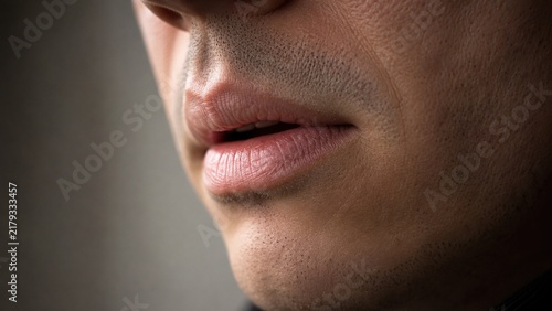 Man Speaking Softly With Natural Emotion in Cinematic Extreme Macro Closeup