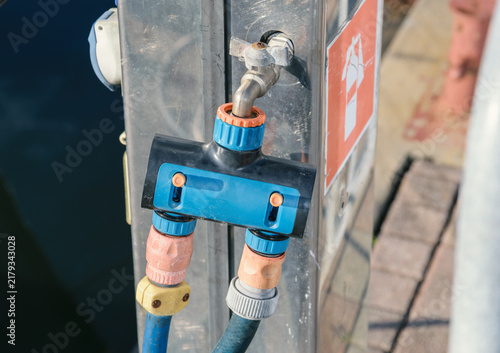 Foto Dockside water faucet with hose connectors and marina utility fittings