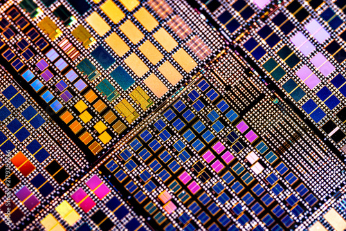 Silicon semiconductor wafer with integrated circuit die mosaic pattern.