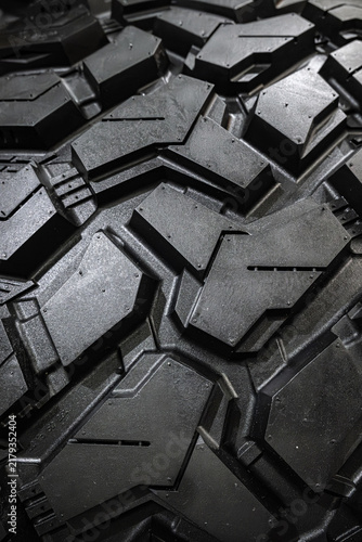 Obraz na plátně Black tire tread texture background with detailed rubber pattern.