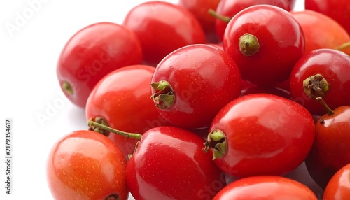 Fresh ripe red cherry tomatoes in cluster.