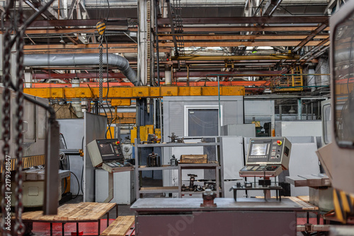 Canvas Print Interior of modern industrial manufacturing factory with machinery and control panels