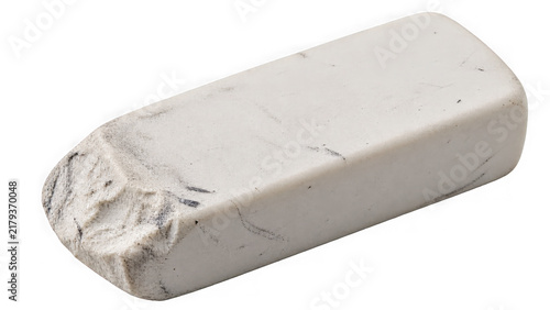 Well-used white eraser with textured edges on a clean white background