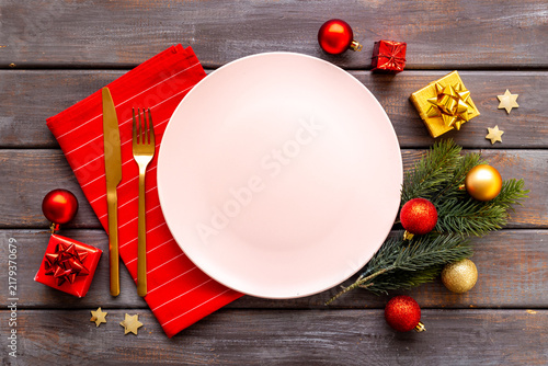 Festive Christmas table setting with red colored decoration. Top view