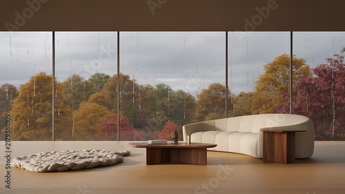 Modern minimalist living room interior with curved sofa overlooking rainy autumn forest trees through floortoceiling glass windows