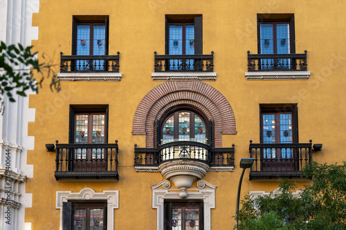 Close up of European architectural details on yellow plaster wall