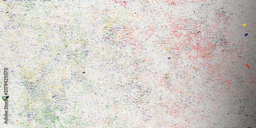 Abstract speckled texture background, colorful paint splatters on white paper, artistic grainy overlay for graphic design projects