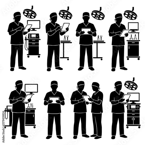 Surgeons using tablets in operating room silhouettes