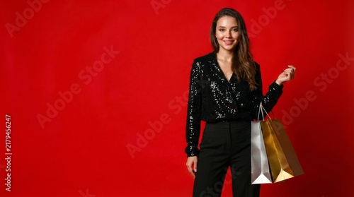 Black Friday, New Year, and Christmas Shopping Sale Concept with Smiling Glamorous Woman