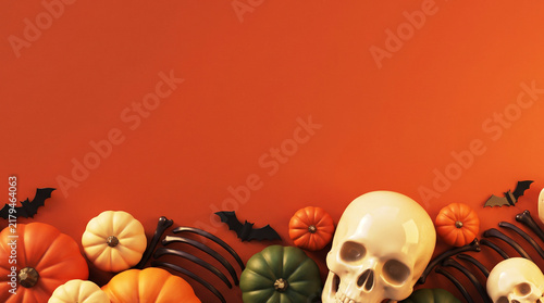 Spooky Halloween Flat Lay Background Border With Pumpkins Skulls And Skeleton Bones On Orange