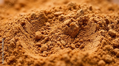 Close up view of fine pumpkin powder with texture and small lumps for baking and cooking ingredients