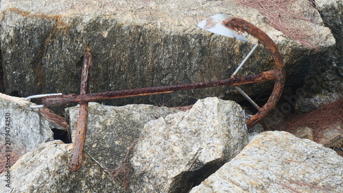Old Rusty Anchor Resting on Coastal Rocks