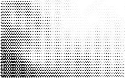 Abstract halftone background with black hexagonal dots fading into white gradient pattern