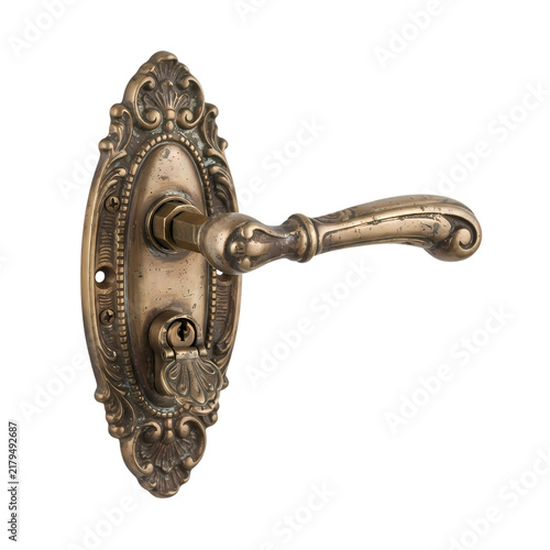 Antique brass door handle with ornate vintage backplate isolated on white background