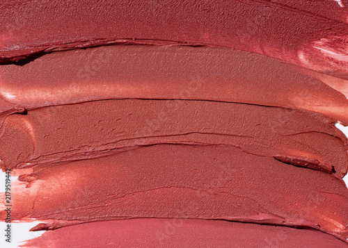 Close up lipstick texture on light surface