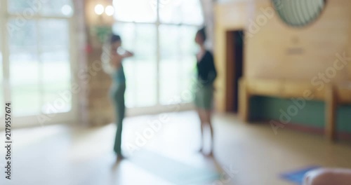 Group, yoga and blur in class, people workout and holistic training for healthy body together. Pilates, fitness team and friends exercise, start meditation and wellness of athlete standing at club