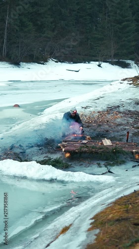 Viking funeral boat burning on frozen lake