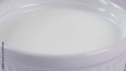 Milk Drop Splashing into Bowl of Milk, Close-up Slow Motion White Liquid Splash	