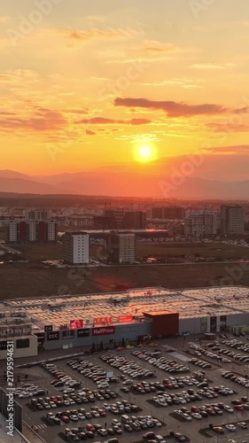 Golden hour sunset over cityscape and shopping mall