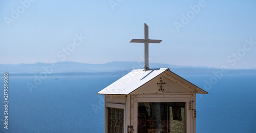 Photography Roadside Orthodox shrine above Aegean Sea in Chios island, Greece under blue sky