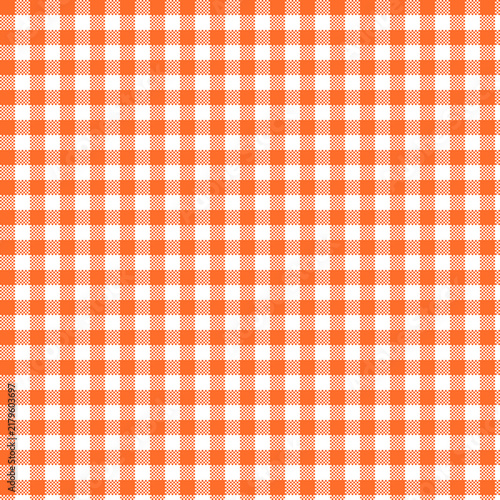 Orange and white gingham check pattern fills the entire frame checkered plaid tablecloth fabric textile