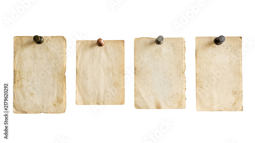 Four aged blank paper sheets pinned on transparent background in row