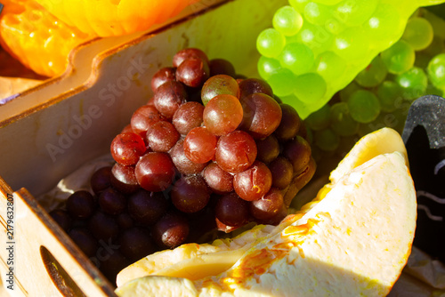 Bright, natural, eco-friendly soap shaped like a melon, grapes, and honeycomb. Decorative, souvenir-style shaped soap, scented soap, gift. Soap shaped like fruit and honey.