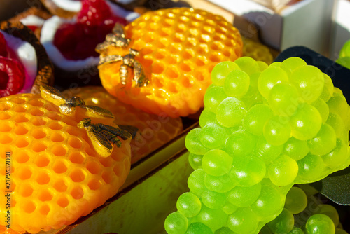 Bright, natural, eco-friendly soap shaped like green grapes and honey. Decorative, souvenir-style shaped soap, scented soap, gift. Fruit-scented soap