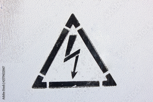 Warning sign risk of electric shock. Text indicating a warning about electrical voltage and electric current, wallpaper