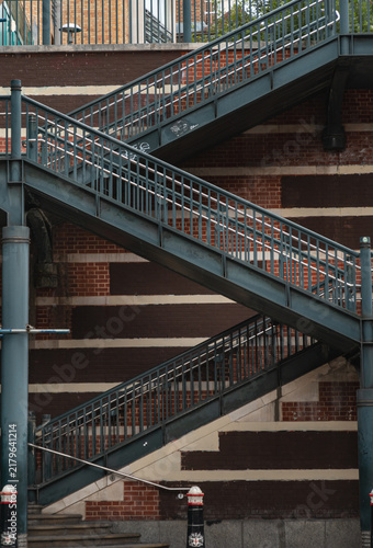 Photography View of external stairs with metal railings built against a brick wall on Apothecary Street in London, use it as your Wallpaper, Poster and Sapce for text, Selective focus