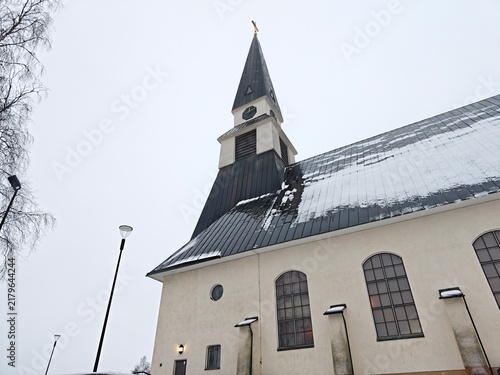 Low angle view of snow-covered exterior of Rovaniemi Church in winter