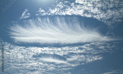 Фотография A Pair Of Rare Elliptical Fallstreak Hole Clouds In The Sky Over The South Of En
