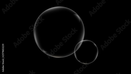 Clear floating soap bubbles isolated on black background