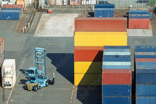 Shipping container stacker in commercial transport port