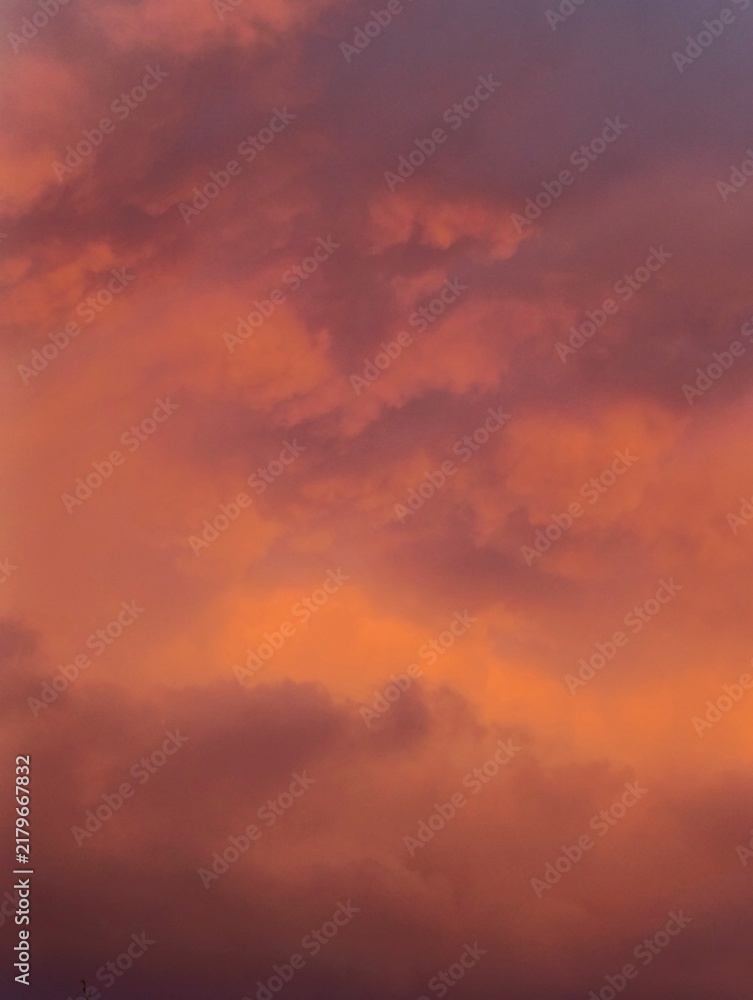 Fototapeta premium Golden hour evening sky overlay with fluffy colorful clouds