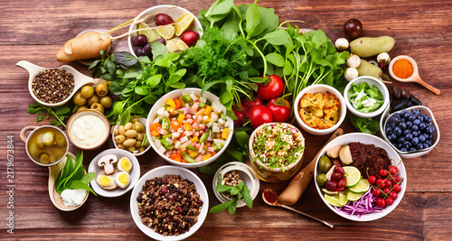 Balanced diet, food preparation, and healthy food concept on a wooden table