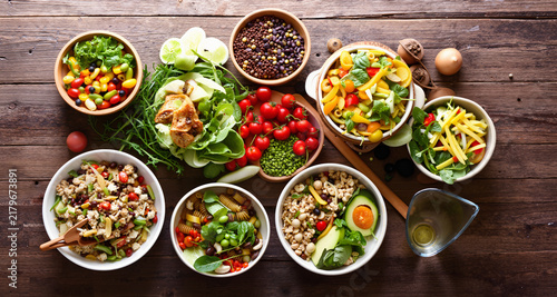 Balanced diet, food preparation, and healthy food concept on a wooden table