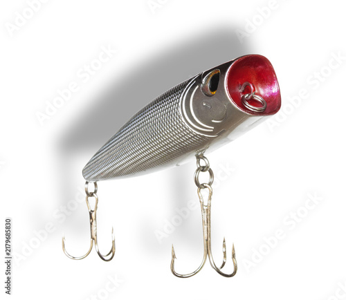 Fotografie Dropshadow behind a red faced artificial fishing lure for the surface of the wat