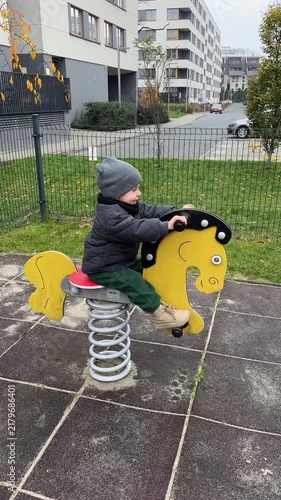 Toddler on spring rider