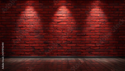 Red brick wall with wooden floor features warm spotlight illumination interior.