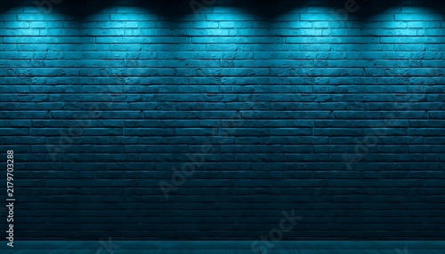 Empty blue brick wall illuminated by spotlights offering copy space.