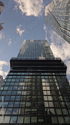 Looking Up Between Modern Skyscrapers Under Blue Sky