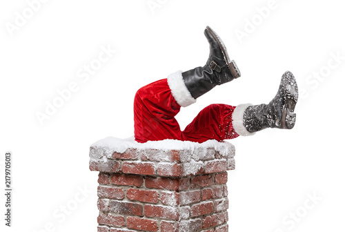 Santa claus legs sticking out of brick chimney