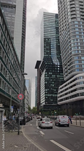 Low Street View Between Modern Skyscrapers With Traffic