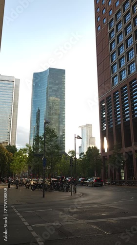 Sunset City Street With Skyscrapers and Moving Traffic